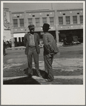 Calipatria. Idle pea pickers come into town and discuss prospects for work on the street corners