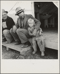 Farm Security Administration (FSA) migratory labor camp. Brawley, California. Father is home after a day in the pea fields. Note tent platform, standard equipment in Farm Security Administration camps