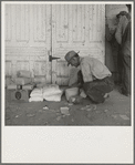 Outside the Farm Security Administration (FSA) grant office during pea harvest. Calipatria, California. During the spring of 1938 for the first time the labor surplus has grown so large that relief grants were necessary even during the peak of harvest