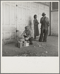 Outside the Farm Security Administration (FSA) grant office during pea harvest. Calipatria, California. During the spring of 1938 for the first time the labor surplus has grown so large that relief grants were necessary even during the peak of harvest