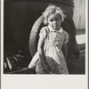 Arkansas girl in migrant camp near Greenfield, Salinas Valley, California. This is an Arkansawyers auto camp, filled almost completely with Arkansawyers recently in California. Rent ten dollars per month for one room, iron bed, electric light