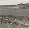 U.S. 99 on ridge over Tehachapi Mountains. Heavy truck route between Los Angeles and San Joaquin Valley over which migrants travel back and forth