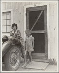 Greenfield, Salinas Valley, California. An Arkansawyers auto camp filled almost completely with migrants from Arkansas. Rent ten dollars a month for one room, iron bed, electricity. Rough board walls with cracks