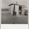 Laundry facilities for ten cabins at Arkansawyers auto camp, Salinas Valley, California. Note stove to heat water