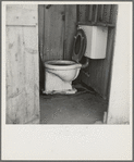 Toilet for ten cabins, men, women and children in auto camp for Arkansawyers, recent migrants to California. Rent for cabins ten dollars a month. Greenfield, Salinas Valley, California