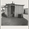 Toilet for ten cabins, men, women, and children. In Arkansawyers auto camp. Greenfield, California