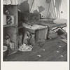 Tent interior in a pea pickers' camp. Food supply and household equipment. Santa Clara County, California