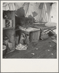 Tent interior in a pea pickers' camp. Food supply and household equipment. Santa Clara County, California