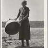 A grandmother in a contractor's camp. Stanislaus County, California. "Been in California fourteen months from Oklahoma. The main thing is to get our families located and quieted down. Ain't no use to send them back; it's a waste of money. They won't stay."