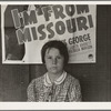 Advertisement for current movie in town. The child is a flood refugee of March 1938 from southeast Missouri. Westley, California