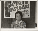 Advertisement for current movie in town. The child is a flood refugee of March 1938 from southeast Missouri. Westley, California