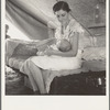 Young migrant mother with six weeks old baby born in a hospital with aid of Farm Security Administration (FSA) medical and association for migratory workers. She lives in a labor contractors camp near Westley, California