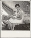 Young migrant mother with six weeks old baby born in a hospital with aid of Farm Security Administration (FSA) medical and association for migratory workers. She lives in a labor contractors camp near Westley, California