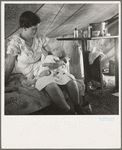 Young migrant mother with six weeks old baby born in a hospital with aid of Farm Security Administration (FSA) medical and association for migratory workers. She lives in a labor contractors camp near Westley, California