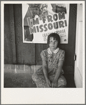 Advertisement for current movie in town. Westley, California. The child is a flood refugee from southeast Missouri