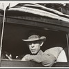Merced (vicinity), California. Migratory cotton picker on highway near Merced, California. He and his family from Independence, Kansas, have been looking for work chopping cotton