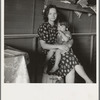 Tulare County, California. In Farm Security Administration (FSA) camp for migratory agricultural workers. Mother with sick baby awaits arrival of FSA camp resident nurse