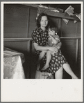 Tulare County, California. In Farm Security Administration (FSA) camp for migratory agricultural workers. Mother with sick baby awaits arrival of FSA camp resident nurse