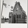 Between Tulare and Fresno on U.S. 99. See general caption. A large variety and great number of service stations face highway