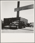 Near Tulare, California, U.S. 99. See general caption. Used car lots and auto wrecking establishments add to the litter which fronts this highway