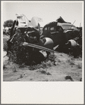 Near Tulare, California, U.S. 99. See general caption. Used car lots and auto wrecking establishments add to the litter which fronts this highway