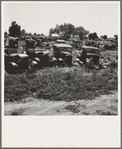 Near Tulare, California, U.S. 99. See general caption. Used car lots and auto wrecking establishments add to the litter which fronts this highway