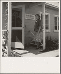 Tulare County, Farmersville, California. Farm Security Administration (FSA) camp for migratory agricultural workers. Entering clinic of Agricultural Workers' Health and Medical Association (FSA) for nurse's help with sick baby