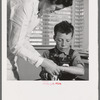 Farm Security Administration (FSA) camp at Farmersville, Tulare County, for migratory agricultural laborers. Migratory boys come to the clinic for attention of the resident nurse of the Agricultural Workers' Health and Medical Association (FSA)