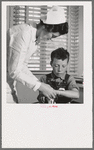 Farm Security Administration (FSA) camp at Farmersville, Tulare County, for migratory agricultural laborers. Migratory boys come to the clinic for attention of the resident nurse of the Agricultural Workers' Health and Medical Association (FSA)