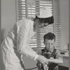 Farm Security Administration (FSA) camp at Farmersville, Tulare County, for migratory agricultural laborers. Migratory boys come to the clinic for attention of the resident nurse of the Agricultural Workers' Health and Medical Association (FSA)