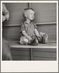 Tulare County, California. In Farm Security Administration (FSA) camp for migratory workers. Baby with club feet wearing homemade splints inside shoes [Farmersville, Calif.]