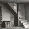 Corner of tobacco farmer's front room. Shows enclosed stairway and corner of the new fancy bed. Person County, North Carolina