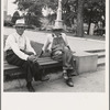 Person County. Farmer in town idling around the county courthouse. Note Confederate monument characteristic of Southern towns. Roxboro, North Carolina