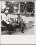 Person County. Farmer in town idling around the county courthouse. Note Confederate monument characteristic of Southern towns. Roxboro, North Carolina