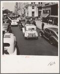 Traffic on Fifth Avenue approaching 57th Street on a summer afternoon. New York City