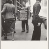 42nd Street and Madison Avenue. Street hawker selling Consumer's Bureau Guide. New York City