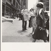 42nd Street and Madison Avenue. Street hawker selling Consumer's Bureau Guide. New York City