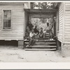 Zollie Lyons, Negro sharecropper, home from the field for dinner at noontime, and part of his family. Upchurch, North Carolina. He has thirteen acres of tobacco and a labor force of five