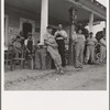 Fourth of July, near Chapel Hill, North Carolina. Rural filling stations become community centers and general loafing grounds. The men in the baseball suits are on a local team which will play a game nearby. They are called the Cedargrove Team