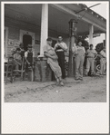 Fourth of July, near Chapel Hill, North Carolina. Rural filling stations become community centers and general loafing grounds. The men in the baseball suits are on a local team which will play a game nearby. They are called the Cedargrove Team