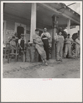 Fourth of July, near Chapel Hill, North Carolina. Rural filling stations become community centers and general loafing grounds. The men in the baseball suits are on a local team which will play a game nearby. They are called the Cedargrove Team