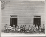 Women of the congregation of Wheeley's Church on steps with brooms and buckets on annual clean up day. Gordonton, North Carolina