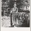 Wife of tenant farmer, Mrs. Oakley, works stringing tobacco during the harvest season. Granville County, North Carolina