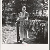 Wife of tenant farmer, Mrs. Oakley, works stringing tobacco during the harvest season. Granville County, North Carolina