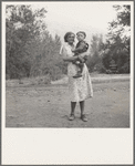 Champion hop picker in squatter camp before the season opens. Earned five dollars a day in the 1938 season. Age twenty three, been on the road seven years. Married. "I think I did pretty well, only have one baby. Want to get out of this living like a dog." Washington, Yakima Valley