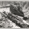 "Catskinner" and bulldozer. They work on contract. Western Washington, Lewis County, near Vader, Washington. See general caption number 41