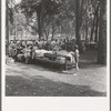 Oregon, Josephine County, Grants Pass. A picnic in town park on Rogue River. "California Day." Hot Sunday afternoon in summer. Participants register