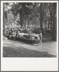 Oregon, Josephine County, Grants Pass. A picnic in town park on Rogue River. "California Day." Hot Sunday afternoon in summer. Participants register