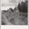 Mrs. Arnold discusses the canning of her tomatoes with the home management supervisor (FSA, Farm Security Administration). Western Washington, Thurston County, Michigan Hill