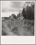 Mrs. Arnold discusses the canning of her tomatoes with the home management supervisor (FSA, Farm Security Administration). Western Washington, Thurston County, Michigan Hill